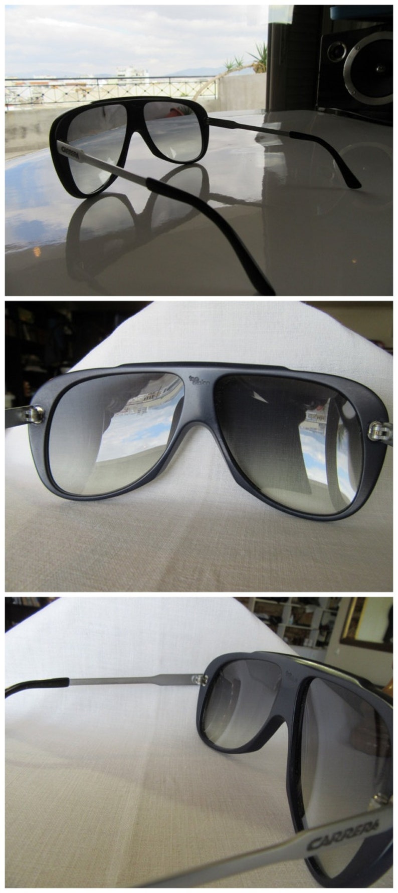 K&ouml;nnte beinhalten: Schwarze Aviator-Sonnenbrille mit silbernem Rahmen und grauen Gl&auml;sern. Die Sonnenbrille spiegelt sich auf einer wei&szlig;en Oberfl&auml;che.