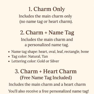May include: Product personalization options are listed on a cream-colored background. Options include a charm only, a charm with a name tag, and a charm with a heart charm. Name tag shapes include heart, oval, leaf, rectangle, and bone.