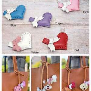 May include: A variety of heart-shaped charms in blue, purple, pink, white, and red, each with a white bow. The image also shows brown tote bags with attached charms, including a smiley face, dog faces, and heart charms.