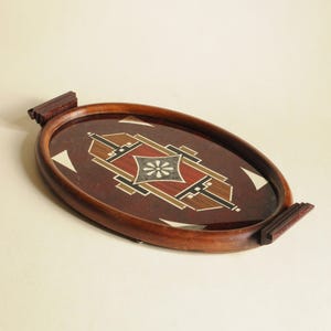 Antik oval art déco-bricka i trä, glas och bakelit - geometriskt mönster