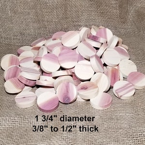 May include: A pile of round cedar wood discs, 1 3/4" in diameter and 3/8" to 1/2" thick.