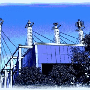 May include: A blue and white building with a large glass facade and several tall towers. The building is surrounded by trees and a blue sky.