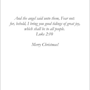 May include: A white card with black text. The text includes a Bible verse from Luke 2:10, "And the angel said unto them, Fear not..." and the greeting "Merry Christmas!" The card is a holiday-themed item.