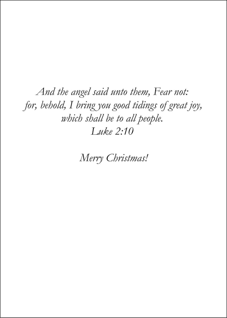 May include: A white card with black text. The text includes a Bible verse from Luke 2:10, "And the angel said unto them, Fear not..." and the greeting "Merry Christmas!" The card is a holiday-themed item.