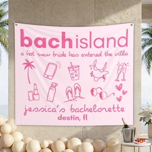 May include: A light pink rectangular fabric banner featuring the dark pink text "bachisland", "a hot new bride has entered the villa", "jessica's bachelorette", and "destin, fl". It includes line art icons of a palm tree, phone, drink, bikini, glasses, lipstick, bottle, flip-flops, and hearts.