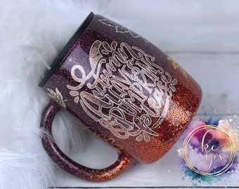 May include: A purple and orange glitter tumbler with a gold metallic design that says "Autumn is my favorite excuse to drink coffee".