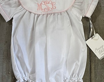 Girls  bubble white with pink trim includes a monogram . Monogram will be in pink to match the trim
