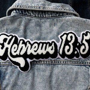 May include: A denim jacket with a white and black embroidered patch that says "Hebrews 13:5".