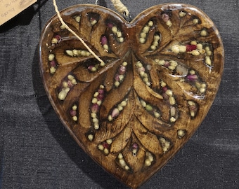 Filigree timber heart with rose and jasmine buds embedded in resin
