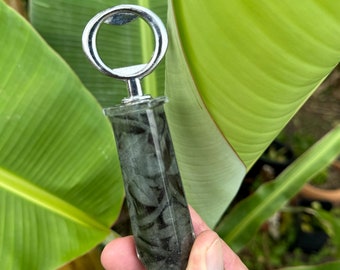 Bottle opener featuring black and white pattern abstract photo in resin
