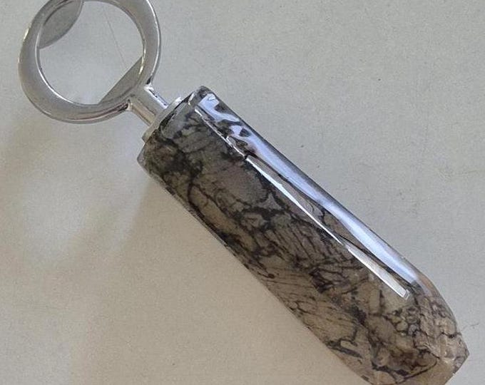 Resin bottle opener featuring Australian mineral photo thin section photograph of garnet set in pyroxene and quartz