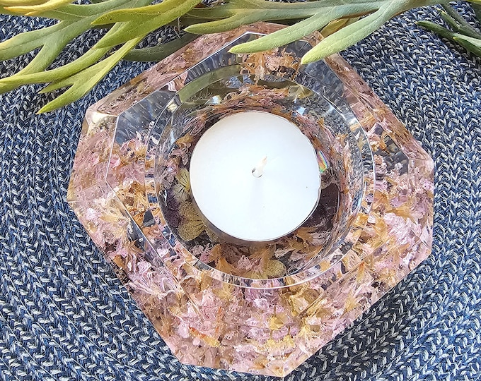 Resin tealight candle holder with embedded dried peppermint geranium and violet flowers