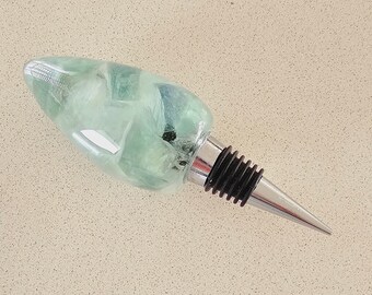 Resin wine bottle stopper with embedded green Jade Quartz stones
