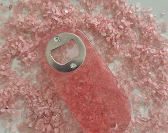 Resin bottle opener with inlaid rose quartz gemstones