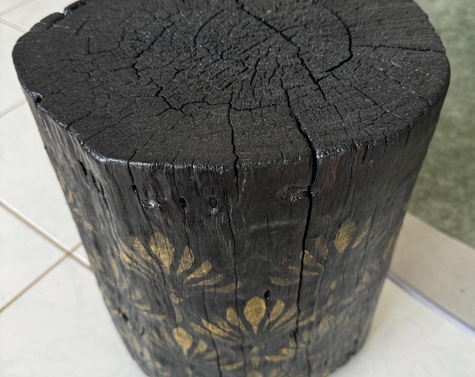 Burnt timber tree Stump Table with gold stylised flower resin artwork