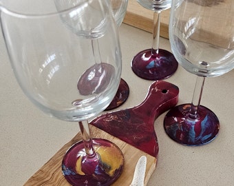 Olive wood board with burgundy resin art and four matching resin art wine glasses