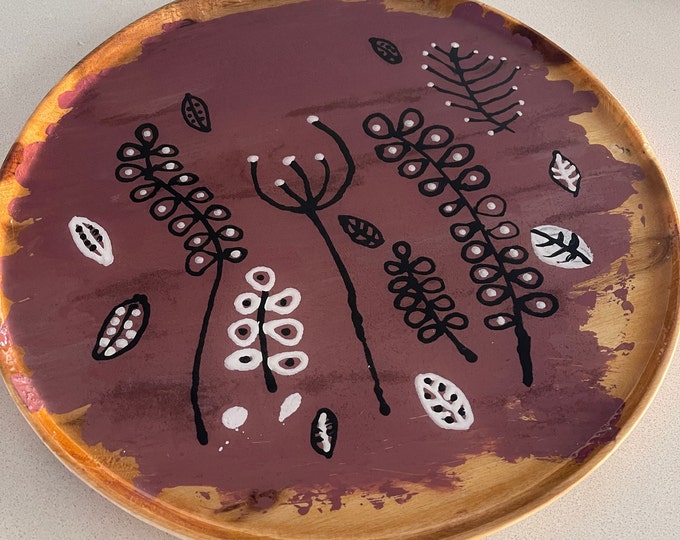 Round wooden platter with original tribal artwork sealed with clear resin
