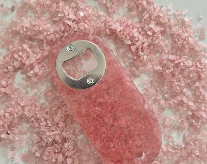 Resin bottle opener with inlaid pink rose quartz gemstones