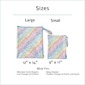 May include: Two reusable bags with a rainbow speckled pattern. The large bag measures 12" x 14" and the small bag measures 9" x 11". Text on the image indicates the bags can hold multiple cloth diapers, a full change of clothes, a baby sleeper, and a toddler change of pants and socks.
