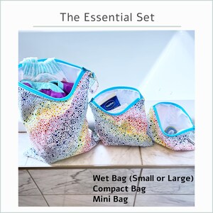 May include: The Essential Set of three bags: a Wet Bag (Small or Large), a Compact Bag, and a Mini Bag. The bags have a white background with a colorful dotted pattern and a turquoise trim. The Wet Bag is open, revealing contents.