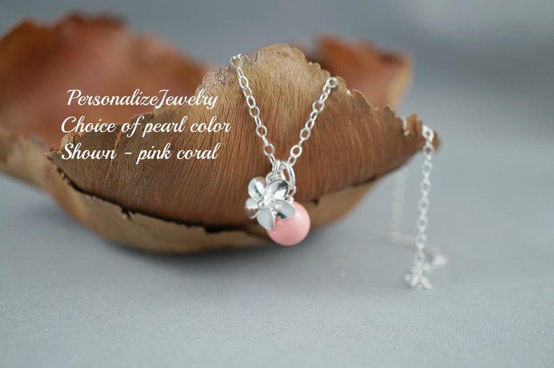 May include: A silver chain necklace with a pink coral pearl and a silver flower charm.  "Personalize Jewelry Choice of pearl color Shown - pink coral"