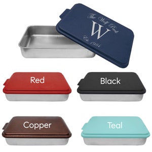 May include: A set of four 9x13 inch baking pans with lids. The lids are available in red, black, copper, and teal. The text "The Wolf Pack Est. 1984" is engraved on the blue lid.