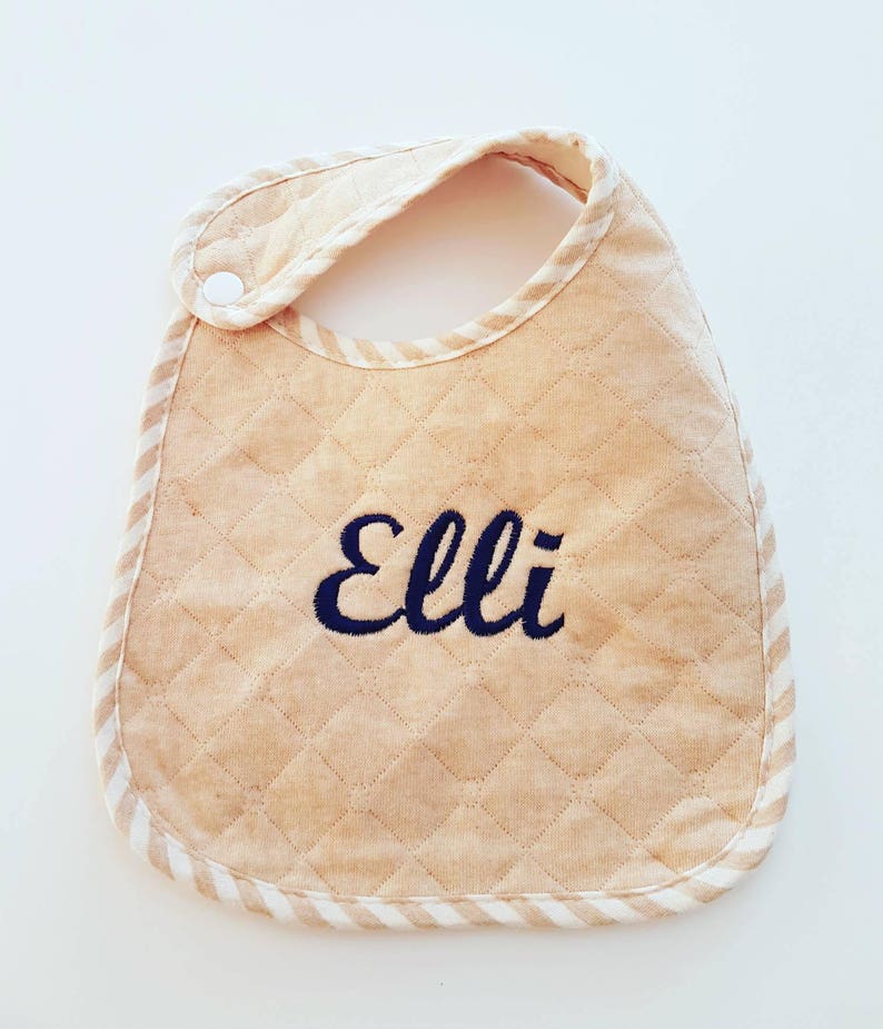 Baby bib monogram using organic quilted fabric with personalise babies name in embroidery