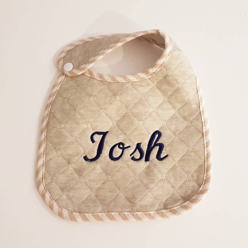 Baby bib monogram using organic quilted fabric with personalise babies name in embroidery