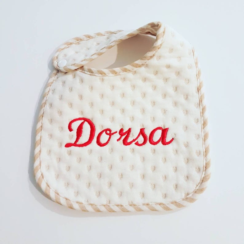 Baby bib monogram using organic quilted fabric with personalise babies name in embroidery