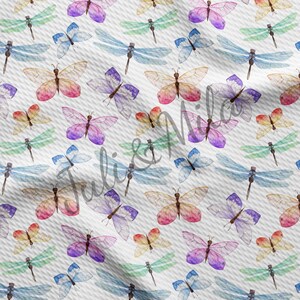 May include: A seamless pattern featuring watercolor illustrations of butterflies and dragonflies in various colors, including pink, purple, blue, green, and yellow. The butterflies and dragonflies are arranged in a random pattern on a white background.