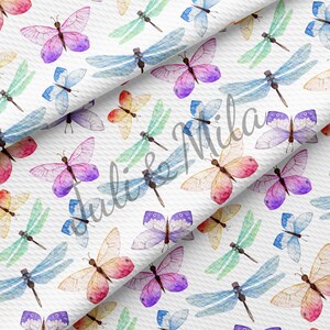 May include: A seamless pattern featuring watercolor illustrations of butterflies and dragonflies in various colors, including pink, blue, green, yellow, and purple. The pattern is set against a white background.