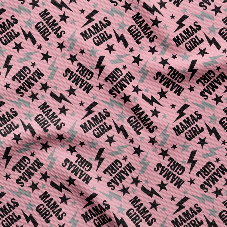 a pink background with black and white stars