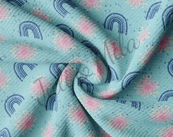 May include: A blue fabric with a repeating pattern of pink and white stylized flowers and navy blue rainbows.