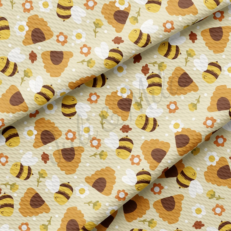 May include: A seamless pattern featuring a repeating design of bees, honeycombs, and flowers in shades of yellow, brown, and white on a cream background.