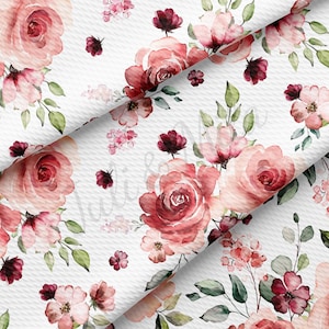 May include: A seamless pattern featuring watercolor pink and burgundy roses, leaves, and small flowers on a white background.