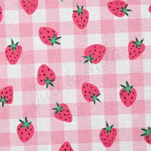 May include: A pink and white gingham pattern with red strawberries repeated throughout the design.