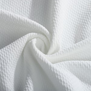 May include: White textured fabric with a soft, crinkled appearance. The fabric is smooth and has a subtle sheen.