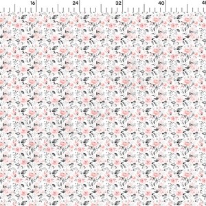 May include: White fabric with a repeating pattern of small pink and gray flowers. The fabric is perfect for crafting projects, quilting, and home decor.