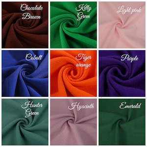 May include: Nine fabric swatches in different colors and textures. The colors are: Chocolate Brown, Kelly Green, Light Pink, Cobalt, Tiger Orange, Purple, Hunter Green, Hyacinth, and Emerald.