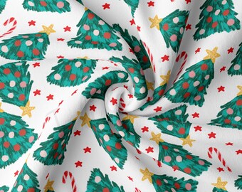 May include: White fabric with a repeating pattern of green Christmas trees with red and white ornaments, gold stars, and red and white candy canes.