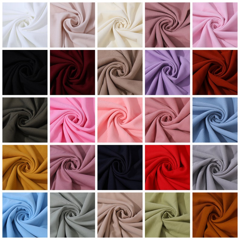 May include: A collection of 25 fabric swatches in various colors, including white, beige, pink, red, blue, green, brown, and gray. The fabric is a waffle knit texture.