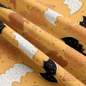 May include: A seamless pattern featuring a variety of bat-shaped cookies with different frosting colors and sprinkles. The cookies are on a yellow background.