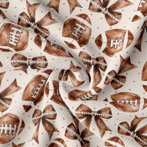 May include: A seamless pattern featuring brown footballs and bows on a beige background with small brown polka dots.