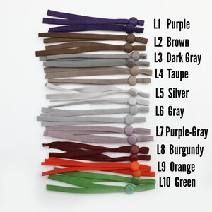 May include: Ten different colors of elastic mask extenders with adjustable toggles. The colors are purple, brown, dark gray, taupe, silver, gray, purple-gray, burgundy, orange, and green.
