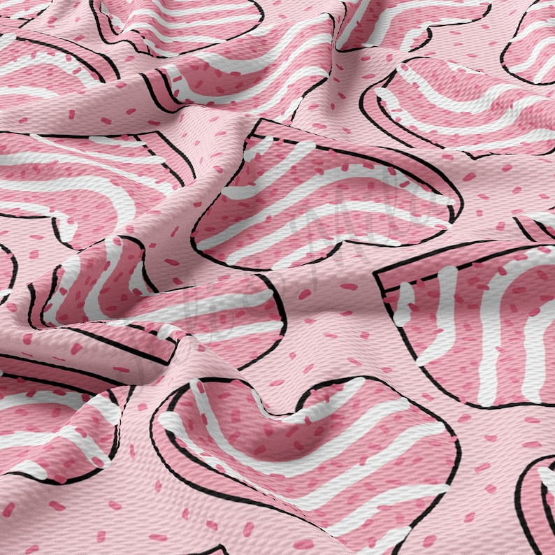 May include: A pink fabric with a repeating pattern of heart-shaped designs. Each heart has white and pink stripes, outlined in black. The background is a lighter pink with small, scattered pink dots.