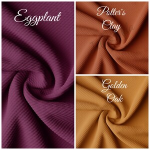 May include: Three fabric swatches in different colors: eggplant, potter's clay, and golden oak. The fabric is a waffle knit with a textured surface.