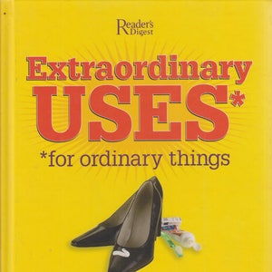 May include: A yellow book cover with the title "Extraordinary USES" in large red letters. The book features a pair of black high heels, toothpaste, and a toothbrush. The book promises 2,317 ways to save money and time.
