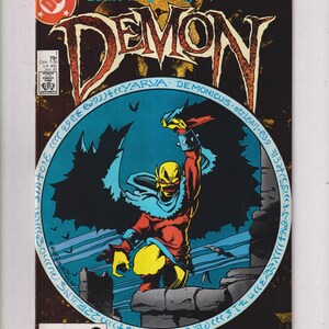 May include: Comic book cover for "Demon" Book 1 of 4, featuring a demonic figure with a yellow face, red and yellow costume, and black wings. The title is in large, stylized letters. The cover includes the text "Who watches the Watchmen?"