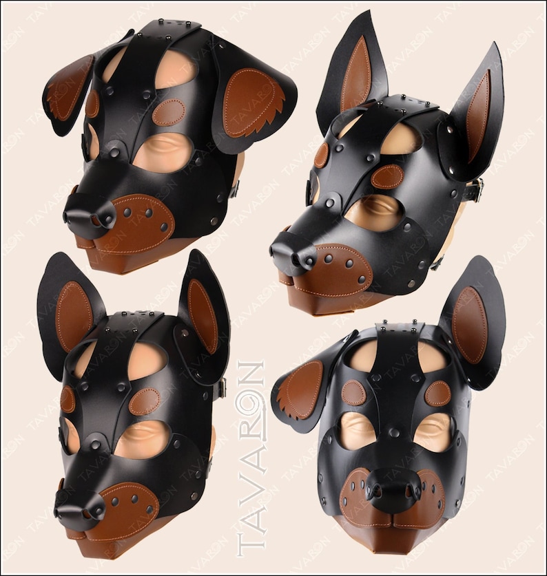 May include: A black leather dog mask with brown leather accents. The mask has a snout, ears, and eye holes. It is decorated with metal studs.