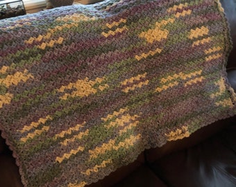 Green, purple, yellow, lavender, and medium blue homemade shell stitch afghan 42" x 50"